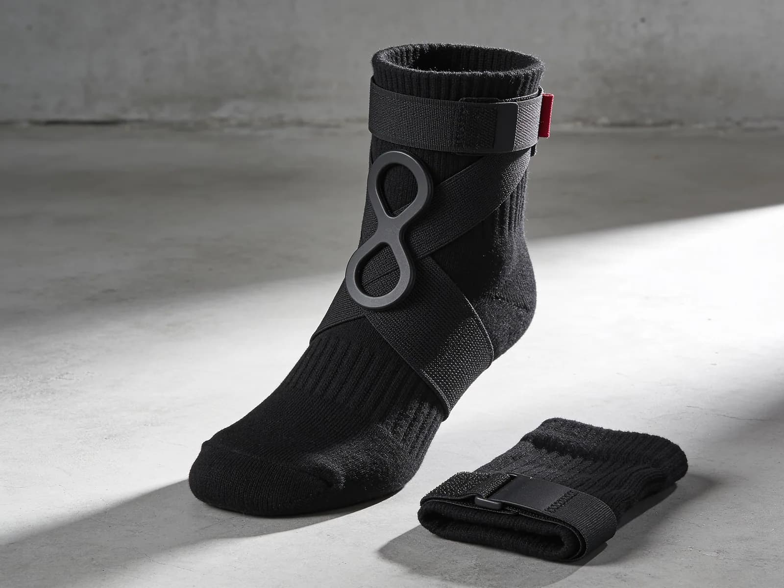 Ankle Support Pair — Knit sleeve with a figure-8 strap. Four sizes.