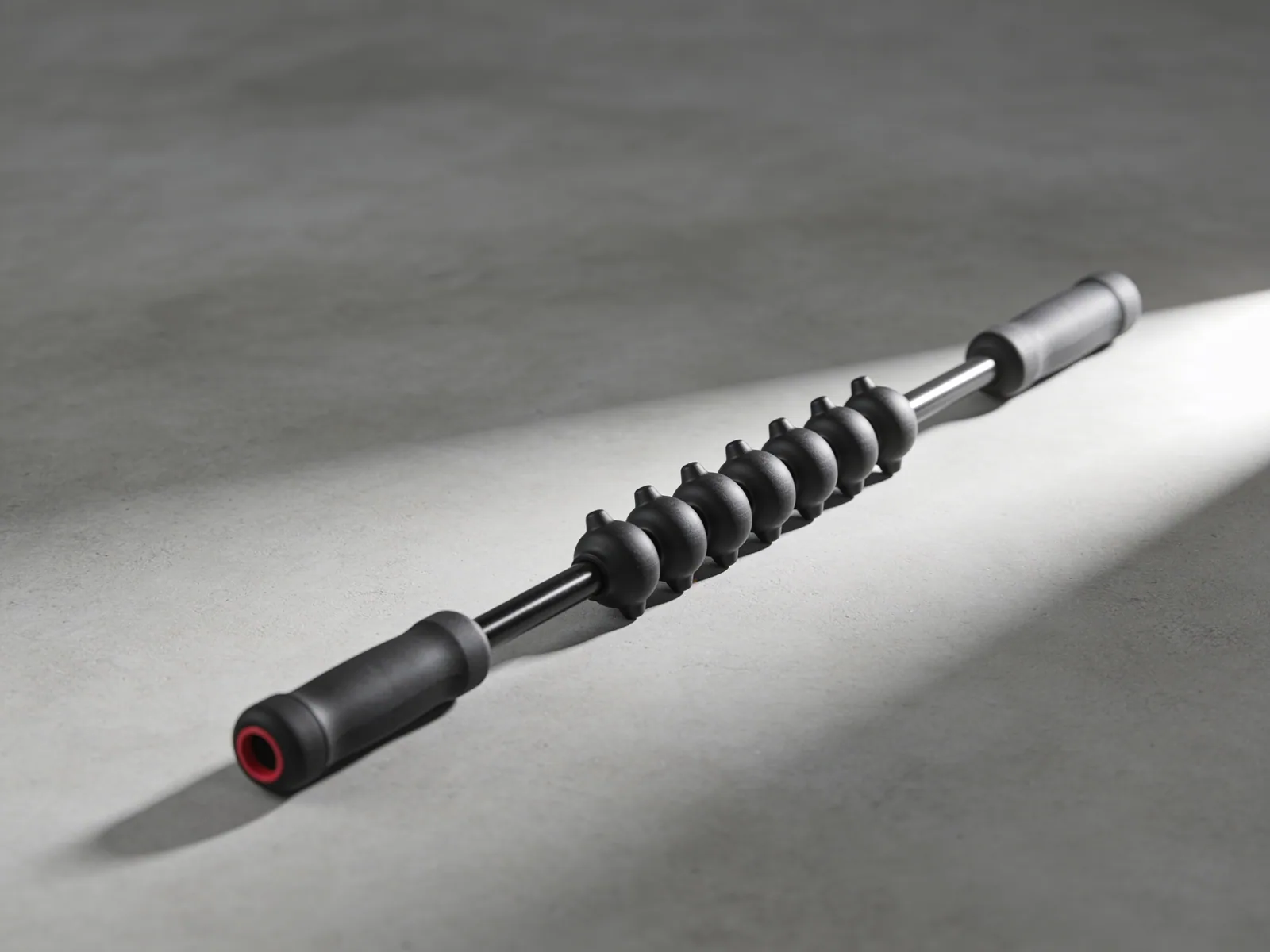 Massage Stick 18 — Nine independent spindles on a steel shaft.